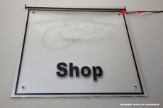 LED company sign cap - shop engraved with indirect lighting